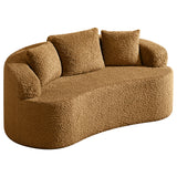 Light brown boucle sofa with three cushions and curved arm, fabric texture visible.