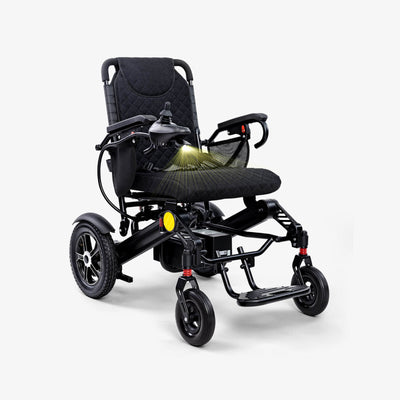Black electric wheelchair on a white background